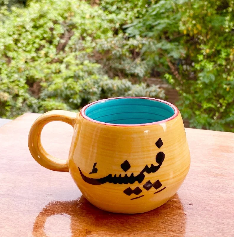 Handcrafted pottery teacups-Feminist Malmo mug in yellow & aqua