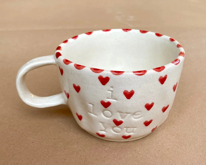 Small ceramic cappuccino cups-I love you wobbly mug with tiny red hearts.